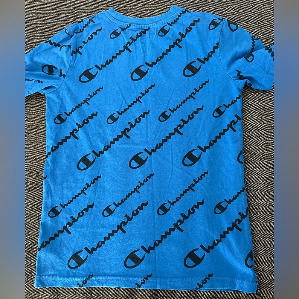 Blue Champion shirt with wording covering front and back of the shirt - Picture 2 of 3